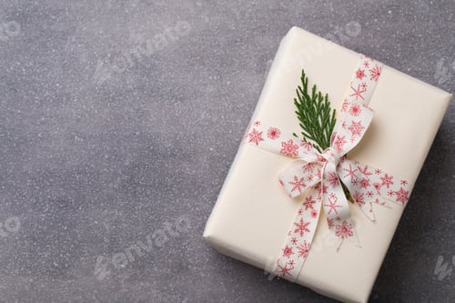 Preview: Wrapped Holiday Gift with Snowflake Ribbon on Gray
