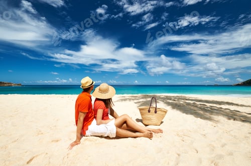 Preview: Couple Relaxing On A Tropical Beach Anse Intendance At Seychelles, Mahe.
