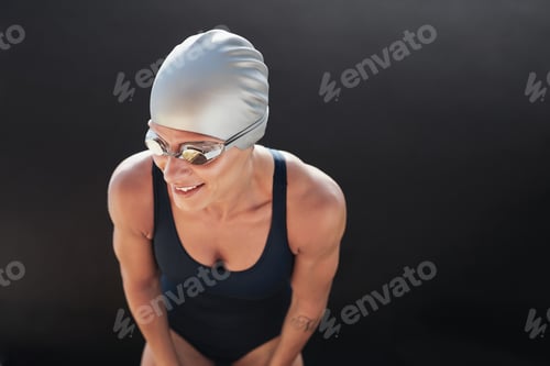 Preview: Female swimmer on black background