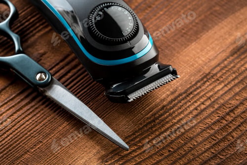 Preview: Hair Trimmer And Scissors On The Wooden Background. Beard And Hair Clippers.