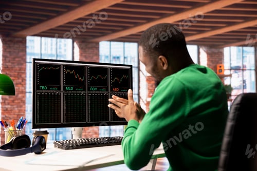 Preview: Day trader rubbing hands in excitement after gaining money by selling stocks