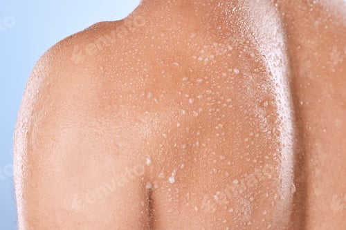 Preview: Water drop, skincare and back of man in studio for cleaning, body care or cosmetic on blue backgrou