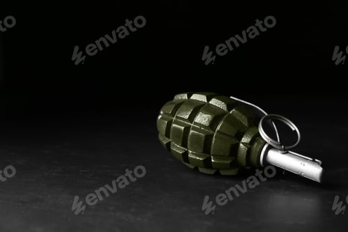 Preview: Hand grenade on black background. Space for text