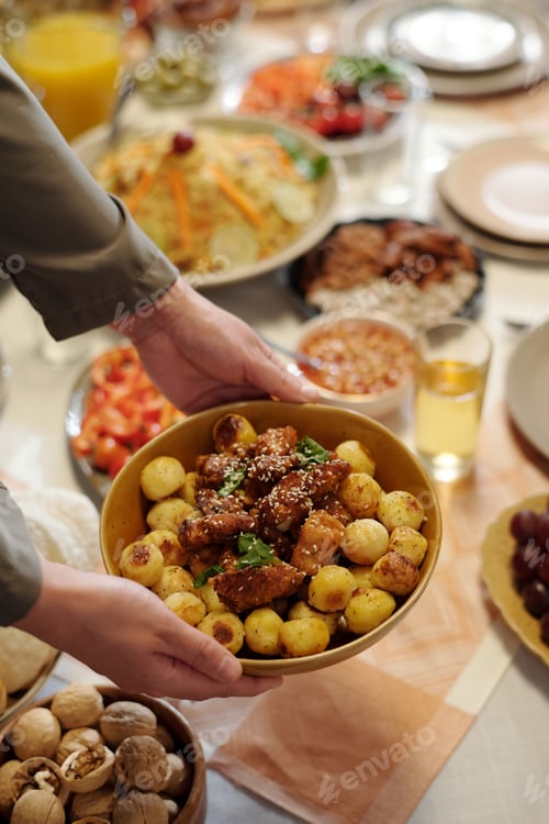 Preview: Hands of Unrecognizable Muslim Woman Setting Festive Table