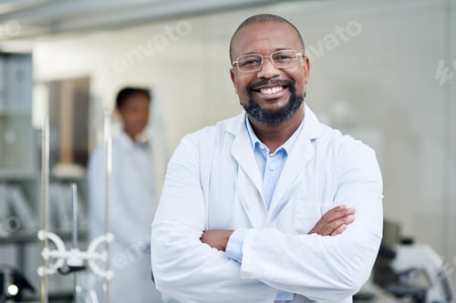 Preview: Portrait of a mature scientist standing with his arms crossed in a lab