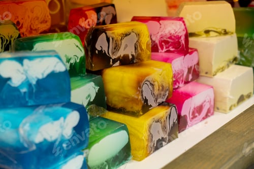 Preview: Handmade aromatic soap. Selective focus. Soaps and cosmetics on street market festival. Craft soap