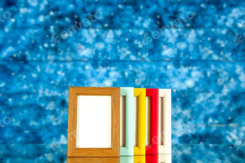 Preview: front view different picture frames with colored corners on blue background picture portrait family