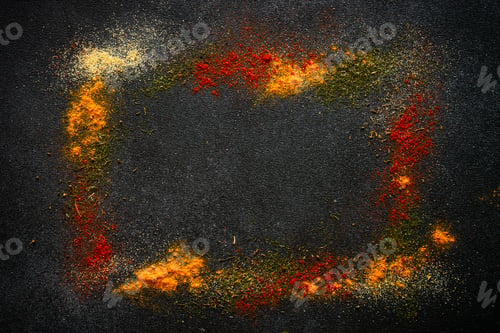 Preview: Spices powder on black slate background top view.
