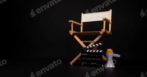 Preview: White director chair with clapper board and megaphone on black background.
