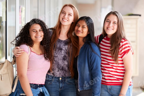 Preview: Portrait Of Smiling Female College Student Friends In Corridor Of Building