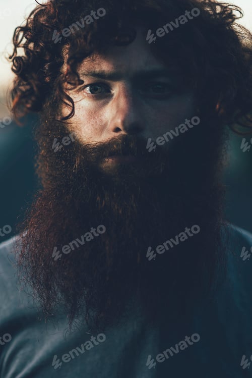 Preview: Contemplative bearded man in shadow
