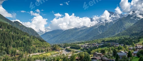 Preview: Panoramic view of the breathtaking Tour Du Mount Blanc with green landscape