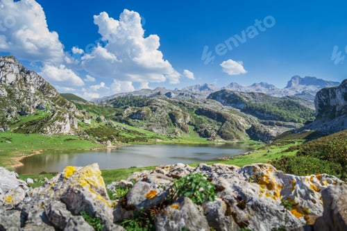 Preview: Scenic view of Covadonga Lakes in Asturias, Spain against a cloudy blue sky
