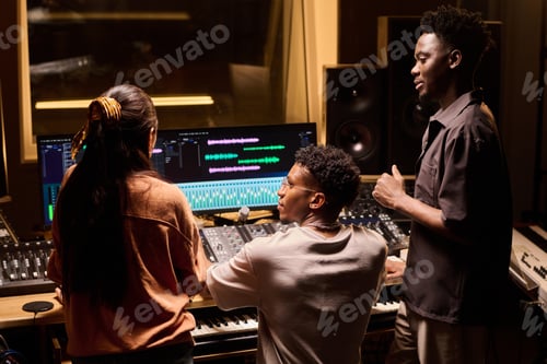 Preview: Young Multiethnic Musicians Collaborating in Recording Studio Producing Music