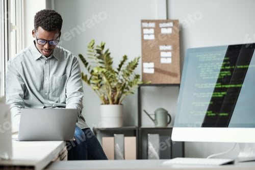 Preview: Young Software Developer in Office