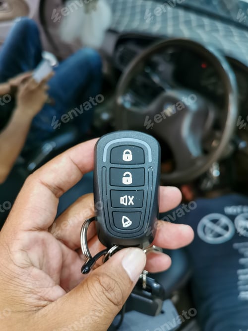 Preview: Close up car remote key isolated on blurry background.