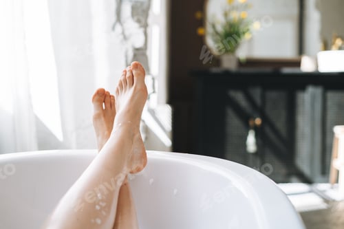 Preview: Young happy woman taking bath at home, treat yourself