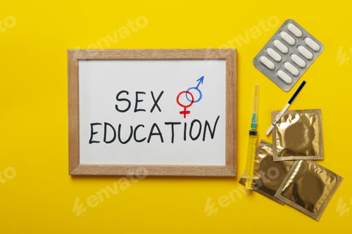 Preview: Text Sex education, pregnancy test, syringe, pills and condoms on yellow background