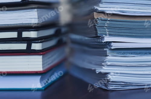 Preview: Accounting and taxes. Large pile of magazine and books