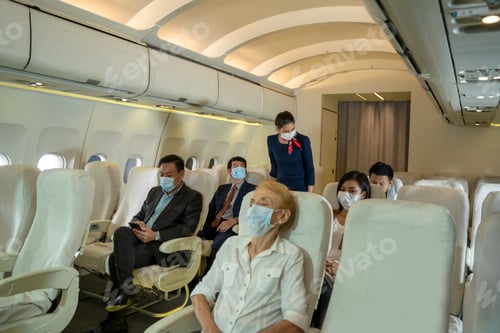 Preview: Passengers Wearing Masks Sit Aboard Commercial Airplane
