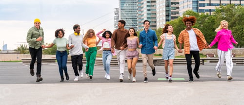 Preview: Happy playful multiethnic group of young friends bonding outdoors