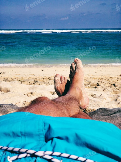 Preview: Man Lying And Enjoying On A Sandy Tropical Beach.