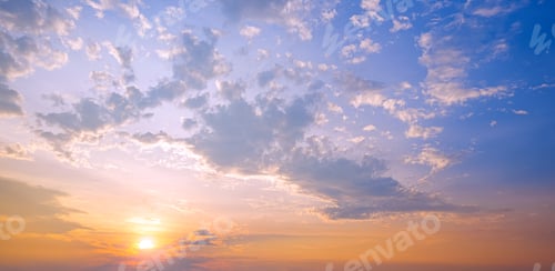 Preview: Sunset sky in the evening with yellow sunlight and clouds on blue sky background in panoramic view