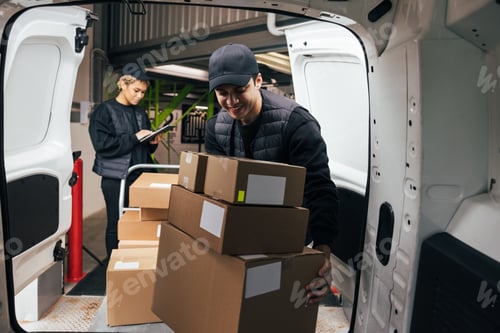 Preview: ourier loads cardboard boxes from a cart into the car