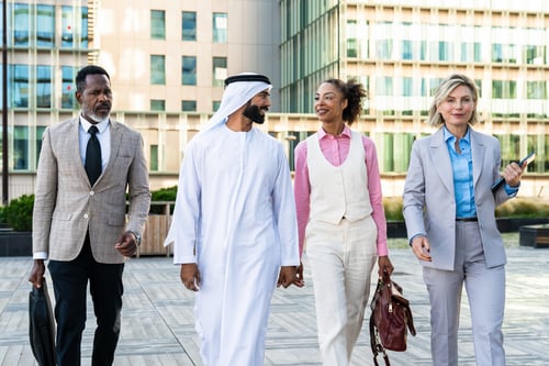 Preview: Group of multiethnic business people meeting an emirati businessman