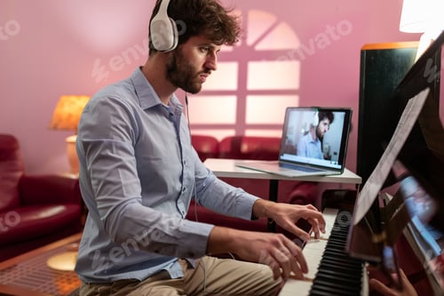 Preview: Boy learning piano lessons with remote computer video call