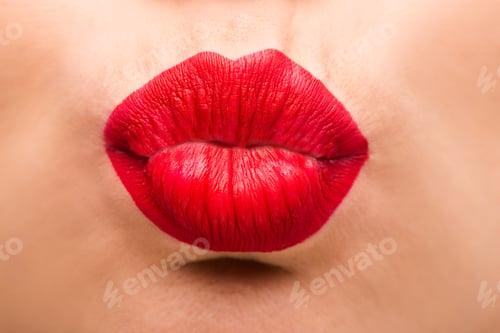 Preview: cropped view of young woman sending blowing kiss
