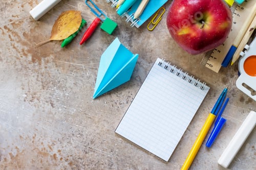 Preview: School supplies, apple and origami plane.