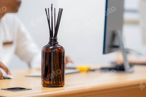 Preview: Brown glass reed diffuser on office desk