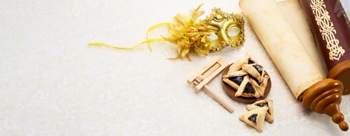 Preview: Purim Celebrations. Golden mask, scroll, gragger, and hamantaschen on decorative background