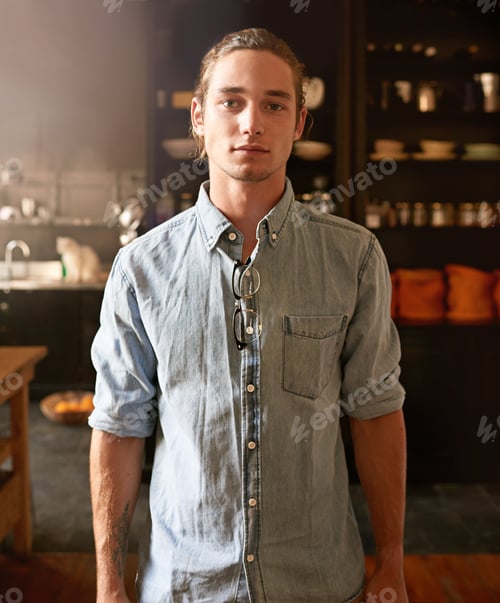 Preview: Ready for the day. Portrait of a handsome young man standing in his kitchen.