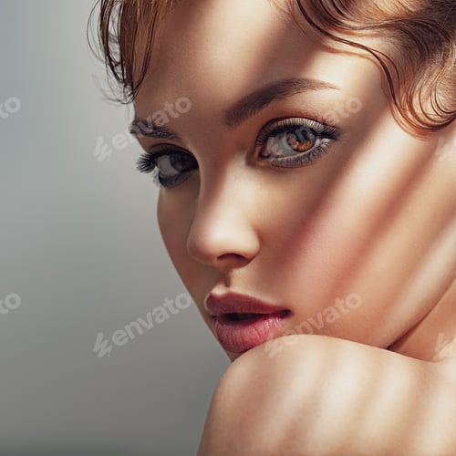 Preview: Beautiful brunette with hard shadows on her face.