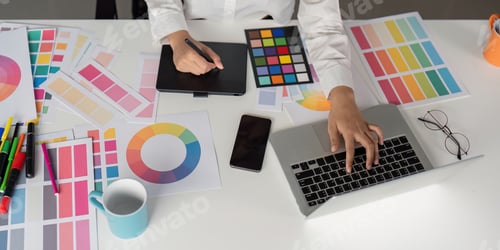 Preview: Creative Graphic Designer Working with Color Palettes and Digital Tools in Modern Office