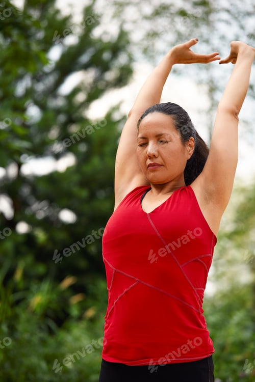 Preview: Adult asian woman doing yoga in nature, doing stretching and flexibility exercises, yoga class for
