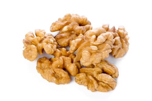 Preview: Walnuts on a white surface ready for use in cooking and baking tasks