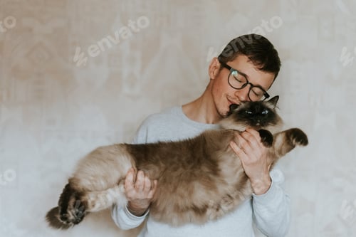Preview: Boy cuddling his adorable big cat