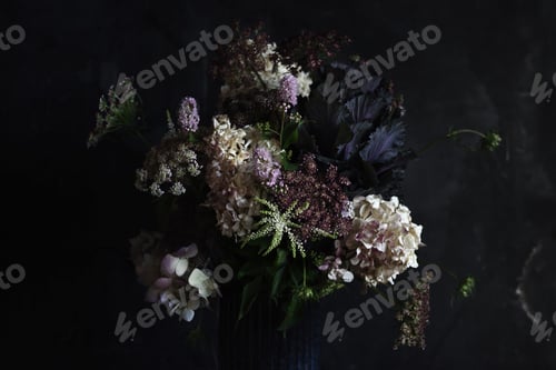 Preview: Beautiful bouquet of wildflowers in a vase on a dark background
