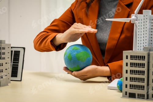 Preview: A businesswoman working at a desk in sustainable urban development, promoting eco-friendly