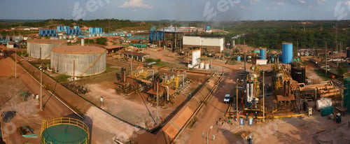 Preview: Panoramic shot of modern factories in an industrial area in the daylight.