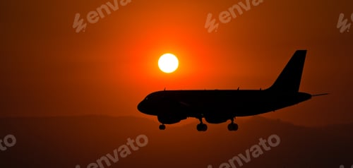 Preview: Beautiful silhouette of an airplane flying during nighttime