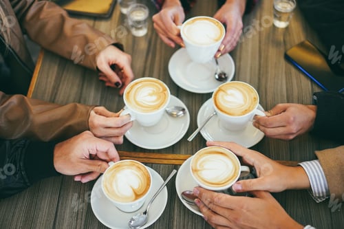 Preview: Hands view of people drinking cappuccino inside vintage cafeteria