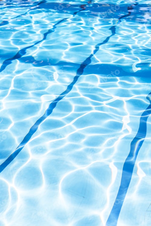 Preview: Ripple Water in swimming pool with sun reflection. Summer day at swimming pool.