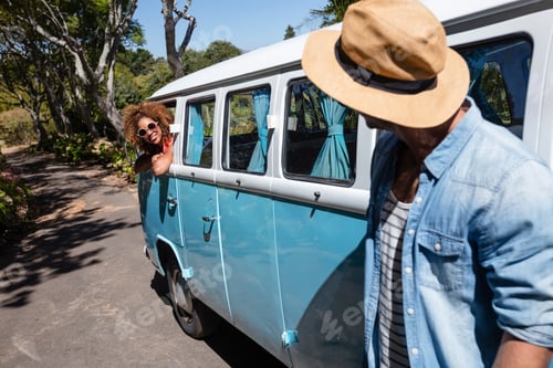 Preview: Man interacting with woman in campervan