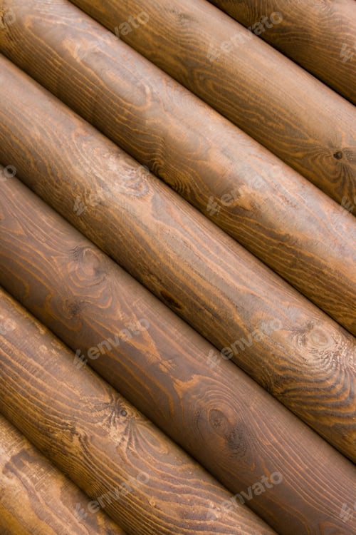Stacked Brown Wooden Logs Forming a Cabin Wall