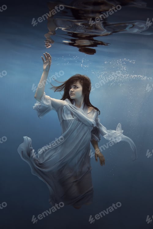 Preview: Portrait Of A Girl In A Blue Dress Under Water
