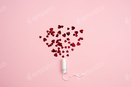 Preview: Tampon with hearts on a pink background.